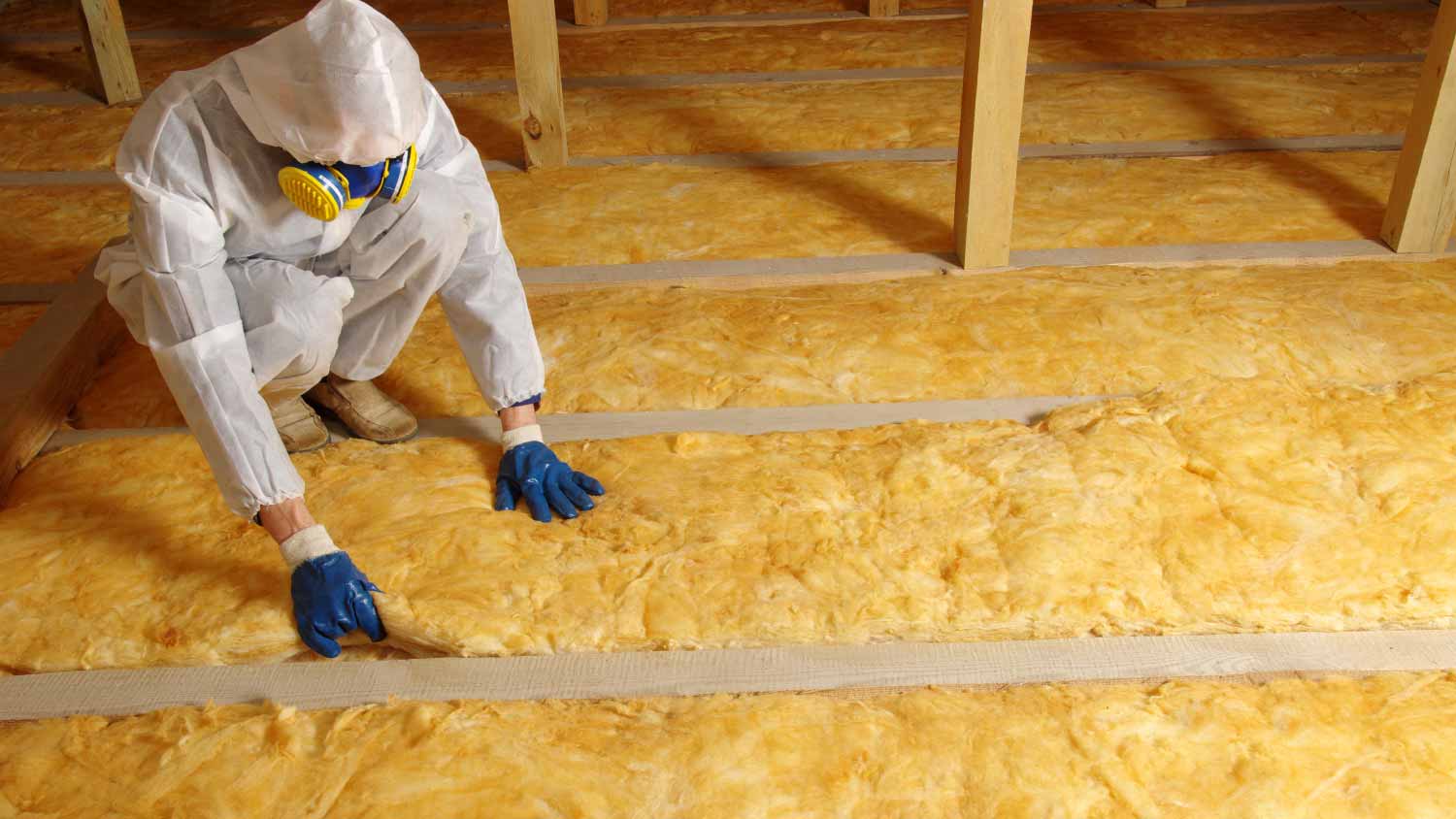 Man installing thermal insulation layer